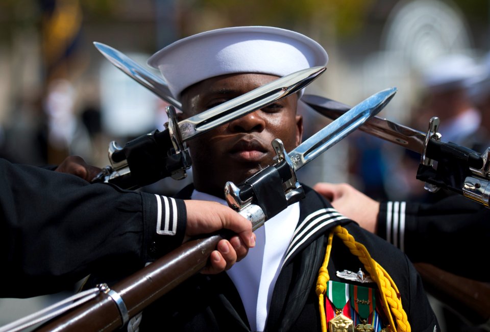 Flickr - Official U.S. Navy Imagery - Sailor stands among spinning rifles.