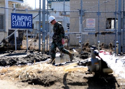 Flickr - Official U.S. Navy Imagery - Sailor surveys Fuel Pumping Station 2 that was damaged during tsunami.