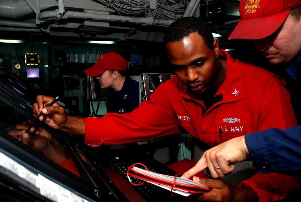 Flickr - Official U.S. Navy Imagery - Sailors consult a manual during a drill.