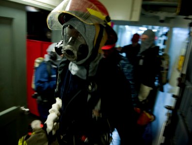 Flickr - Official U.S. Navy Imagery - Sailor responds to a simulated casualty during drill.