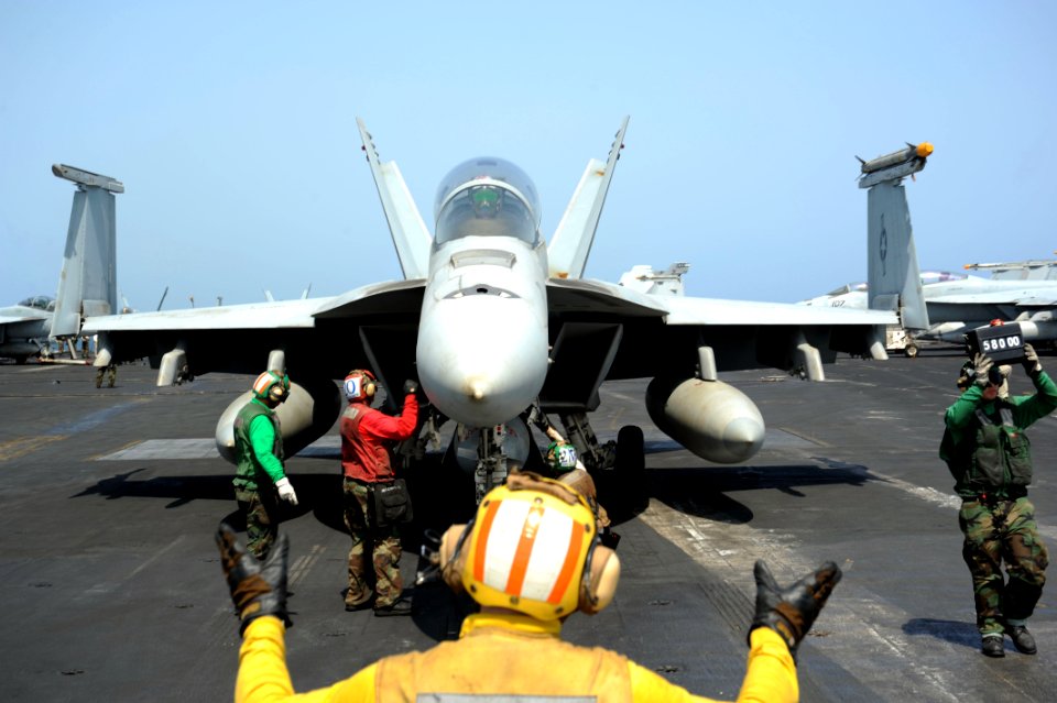 Flickr - Official U.S. Navy Imagery - Sailors direct an F-A-18 Hornet aboard USS Enterprise.