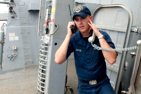 Flickr - Official U.S. Navy Imagery - Sailor uses a satellite phone.