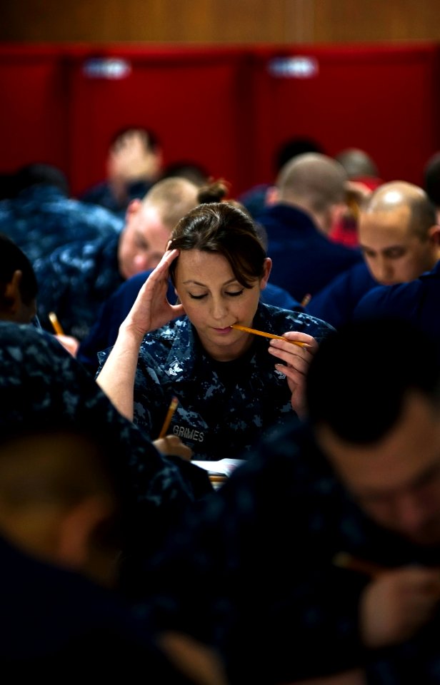 Flickr - Official U.S. Navy Imagery - Sailors focuses on her advancement exam.