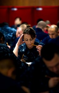 Flickr - Official U.S. Navy Imagery - Sailors focuses on her advancement exam. photo