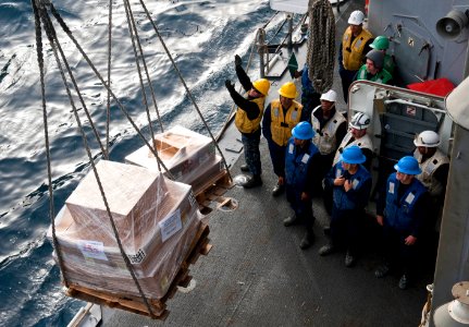 Flickr - Official U.S. Navy Imagery - Sailors guide a pallet into place on the deck.