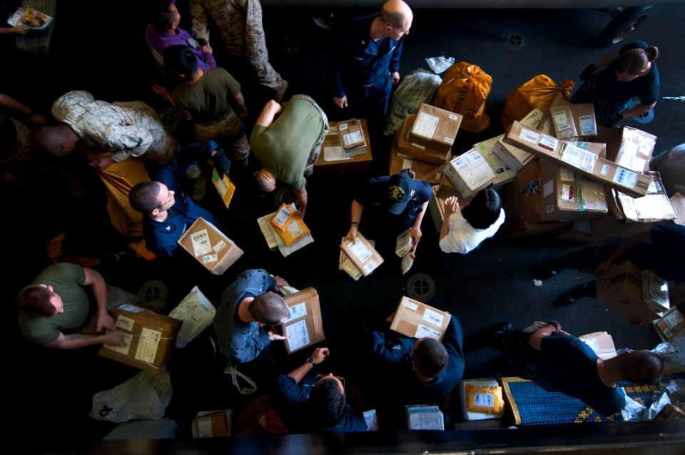 Flickr - Official U.S. Navy Imagery - Sailors and Marines sort through mail in the hangar bay.