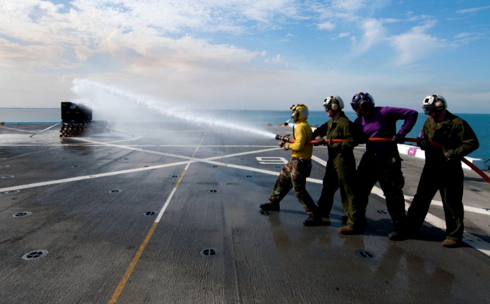 Flickr - Official U.S. Navy Imagery - Sailors and Marines fight a simulated fire during a firefighting drill.