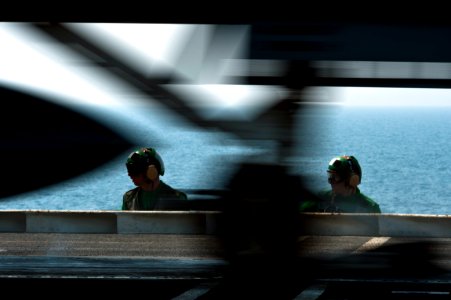 Flickr - Official U.S. Navy Imagery - Sailors man the jet-blast deflectors during flight operations aboard USS John C. Stennis