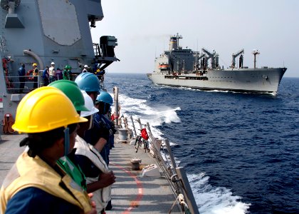 Flickr - Official U.S. Navy Imagery - Sailors man the rails after completing a replenishment at sea.
