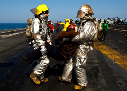 Flickr - Official U.S. Navy Imagery - Sailors carry a simulated casualty during a drill.