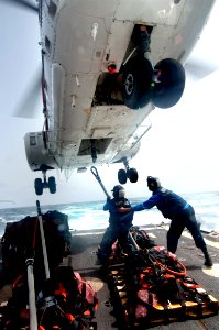 Flickr - Official U.S. Navy Imagery - Sailors attach a pendant to the cargo hook.