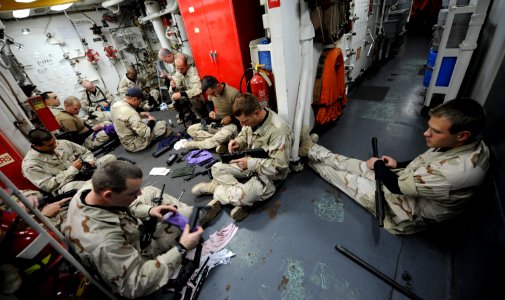 Flickr - Official U.S. Navy Imagery - Sailors clean their weapons.