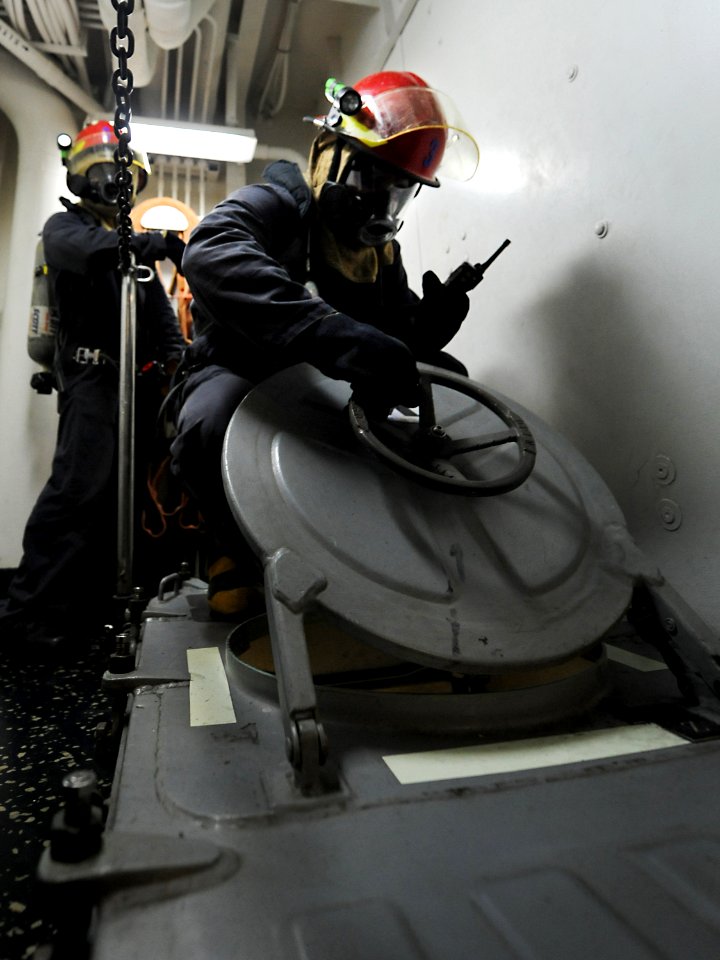 Flickr - Official U.S. Navy Imagery - Sailors open escape scuttle.