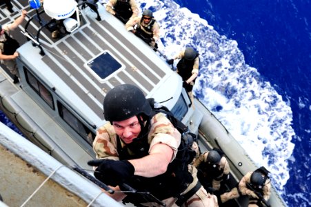 Flickr - Official U.S. Navy Imagery - Sailors climb aboard USS Gunston Hall.
