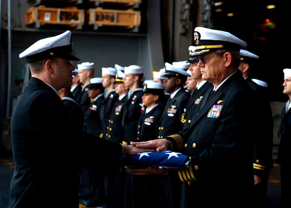 Flickr - Official U.S. Navy Imagery - Sailors pass a flag during a burial at sea