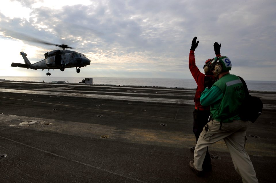 Flickr - Official U.S. Navy Imagery - Sailors direct a helicopter aboard USS Dwight D. Eisenhower.
