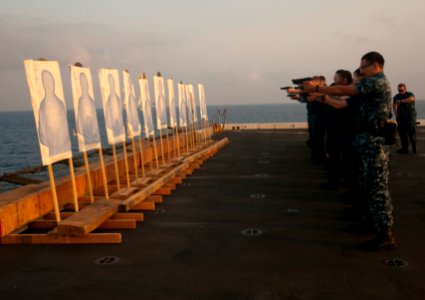 Flickr - Official U.S. Navy Imagery - Sailors fire their 9 mm service pistols at targets during a live-fire small arms qualification. (1) photo