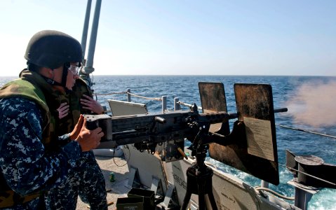 Flickr - Official U.S. Navy Imagery - Sailors fire a gun during a small craft attack team drill.