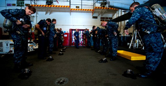 Flickr - Official U.S. Navy Imagery - Sailors don self-contained breathing apparatuses during damage control training.