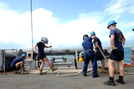 Flickr - Official U.S. Navy Imagery - Sailors flake out a mooring line aboard USNS Grapple.