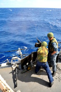 Flickr - Official U.S. Navy Imagery - Sailors fire a .50-caliber machine gun.