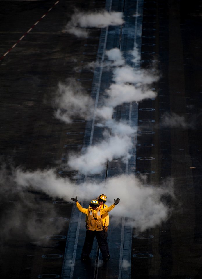 Flickr - Official U.S. Navy Imagery - Sailors guide an aircraft onto the bow catapults of USS Carl Vinson.