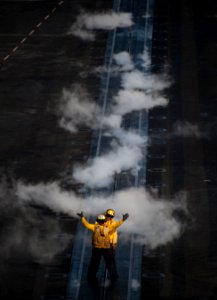 Flickr - Official U.S. Navy Imagery - Sailors guide an aircraft onto the bow catapults of USS Carl Vinson.