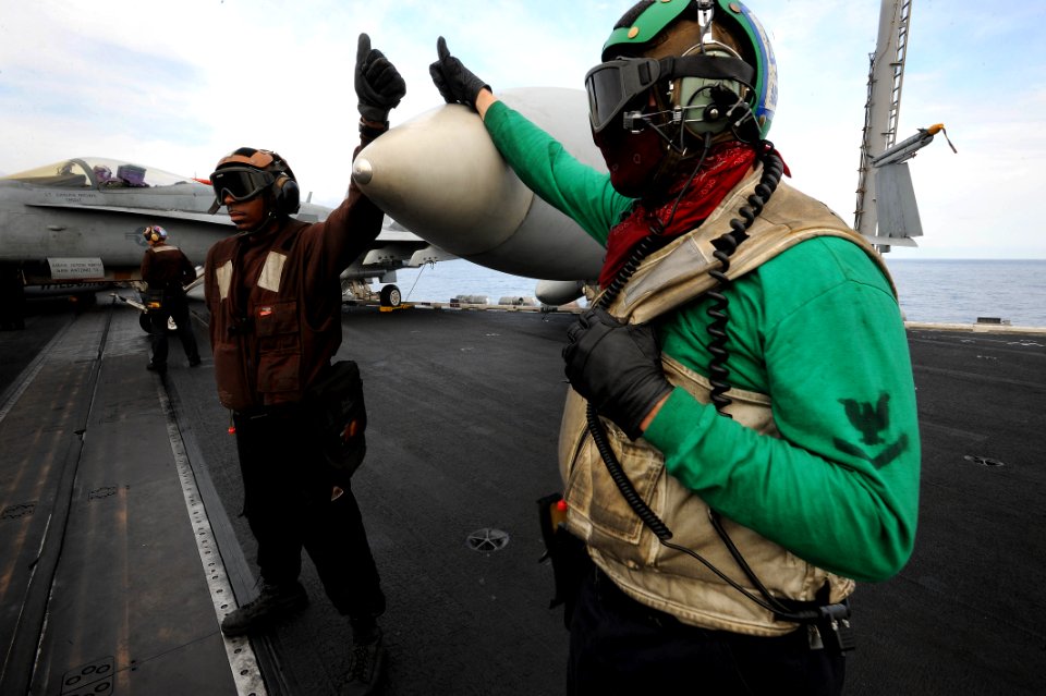 Flickr - Official U.S. Navy Imagery - Sailors give the ready to launch sign to a pilot.