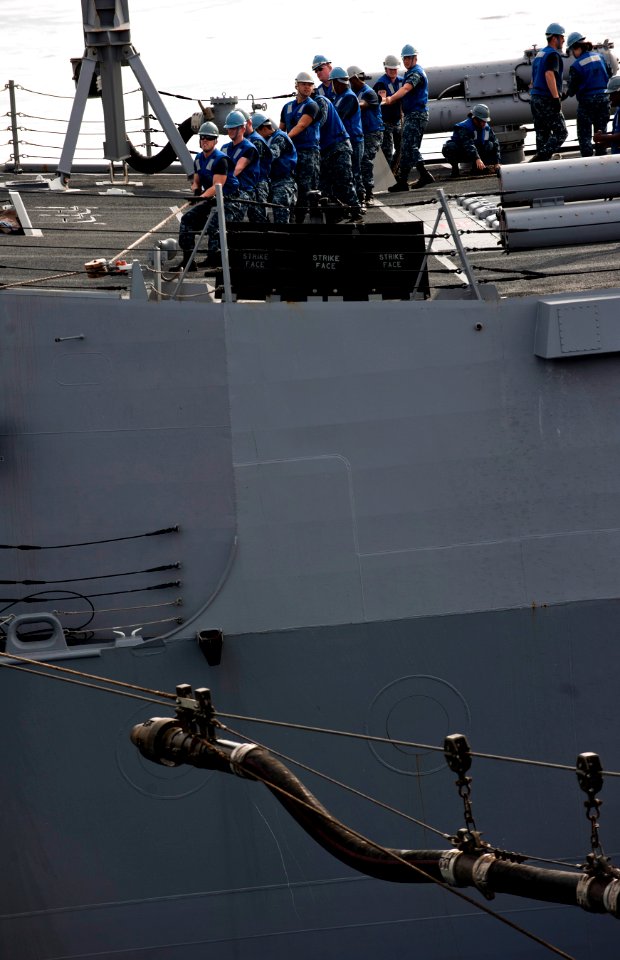 Flickr - Official U.S. Navy Imagery - Sailors heave lines to bring across a refueling probe.