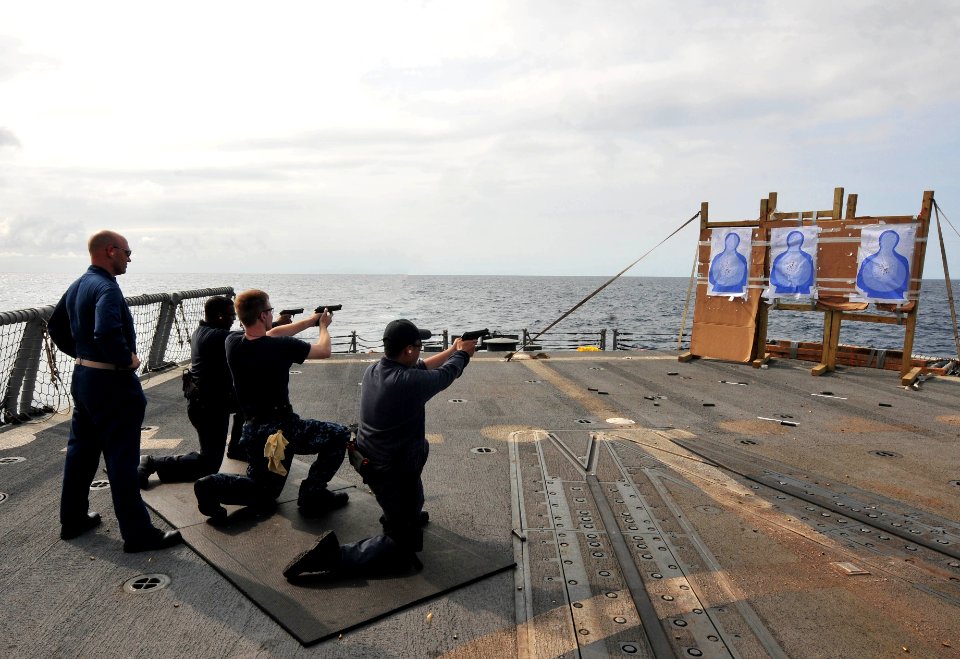 Flickr - Official U.S. Navy Imagery - Sailors qualify with pistols at sea.