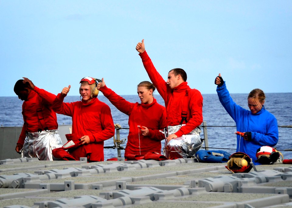 Flickr - Official U.S. Navy Imagery - Sailors give a thumbs up signal during an inspection of safety equipment.