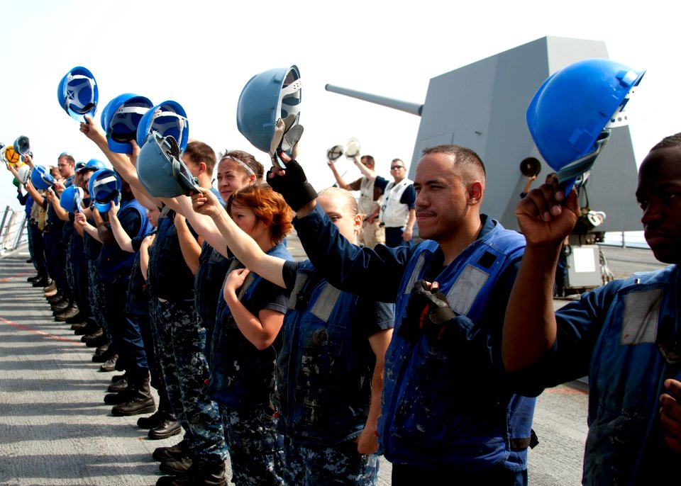 Flickr - Official U.S. Navy Imagery - Sailors raise their hard hats to USNS Rappahannock after completing a replenishment at sea.