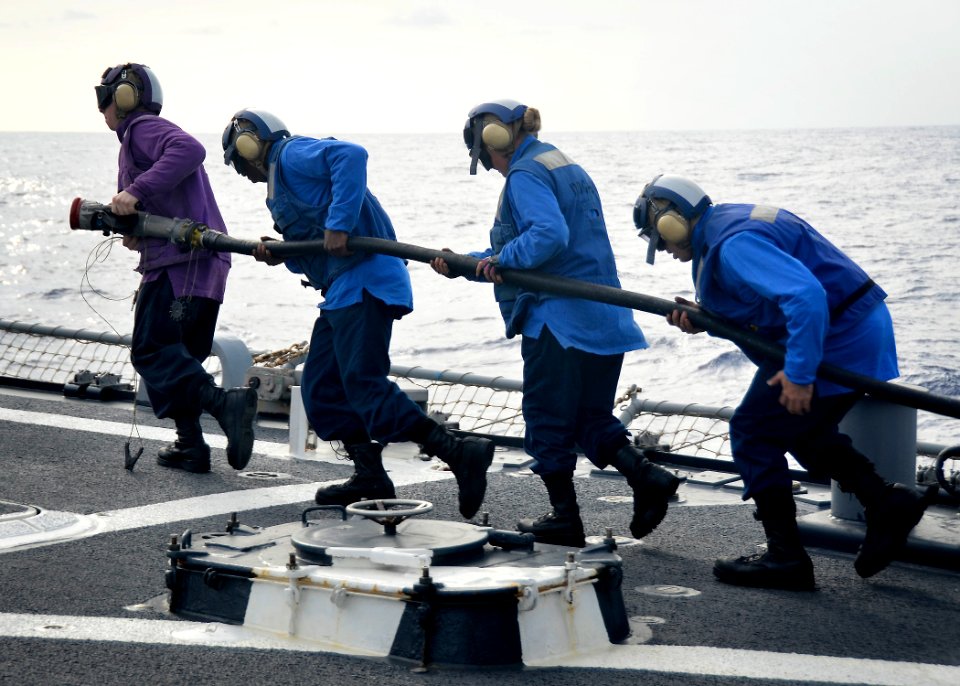 Flickr - Official U.S. Navy Imagery - Sailors refuel a helicopter.