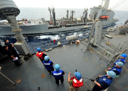 Flickr - Official U.S. Navy Imagery - Sailors heave the phone and distance line on the bridge during a replenishment at sea.