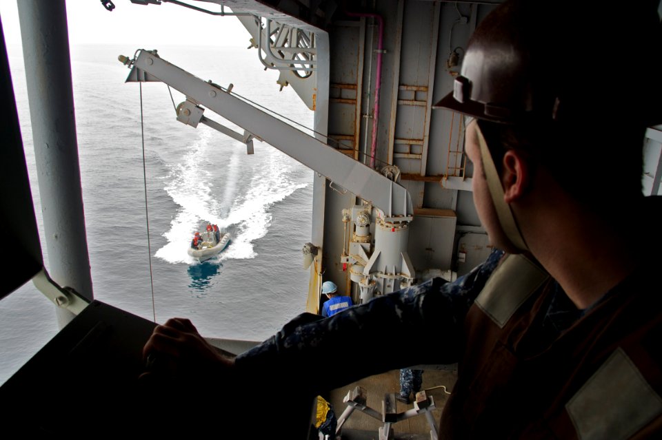 Flickr - Official U.S. Navy Imagery - Sailors retrieve a search and rescue boat during a man overboard drill. (1)