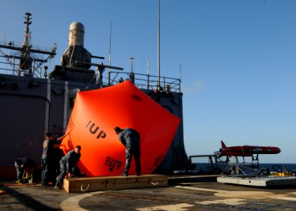 Flickr - Official U.S. Navy Imagery - Sailors inflate the 'killer tomato' on the flight deck of USS Underwood.