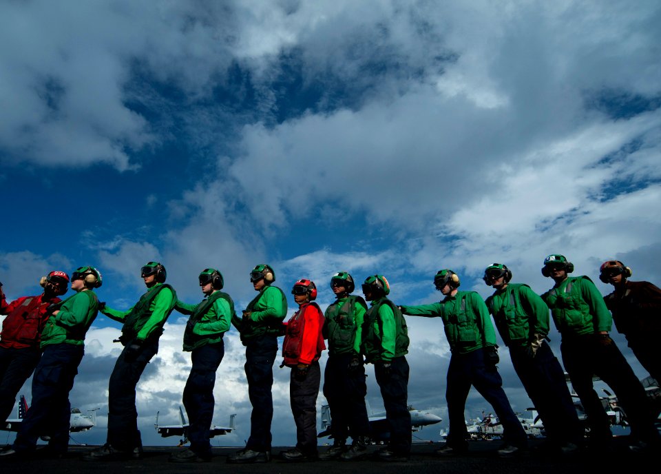 Flickr - Official U.S. Navy Imagery - Sailors line up to relieve hose team members during aircraft firefighting drills aboard USS Carl Vinson.