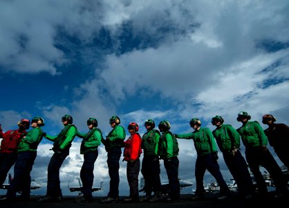 Flickr - Official U.S. Navy Imagery - Sailors line up to relieve hose team members during aircraft firefighting drills aboard USS Carl Vinson.