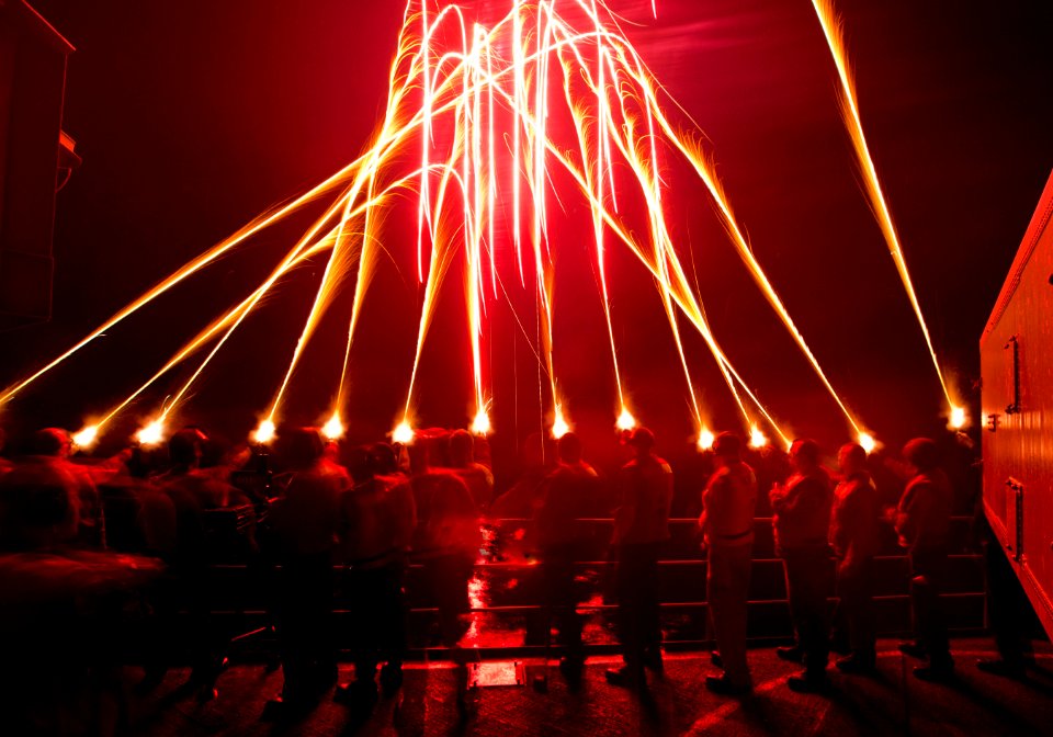 Flickr - Official U.S. Navy Imagery - Sailors light off flares to bring in the new year aboard USS Carl Vinson.