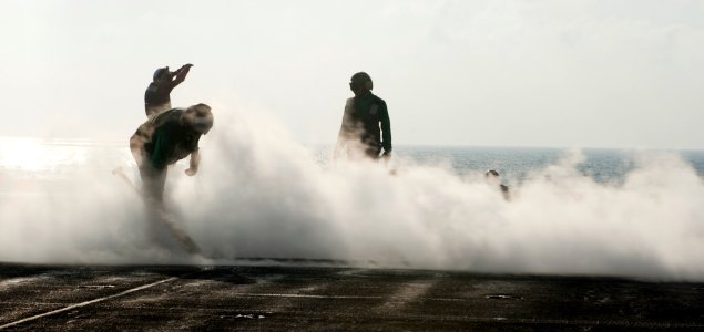Flickr - Official U.S. Navy Imagery - Sailors launched a jet from the flight deck.