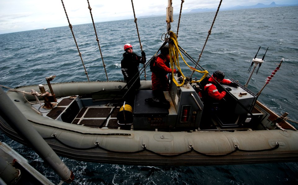 Flickr - Official U.S. Navy Imagery - Sailors lower a RHIB for VBSS training.