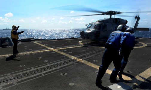 Flickr - Official U.S. Navy Imagery - Sailors move to secure a helicopter.