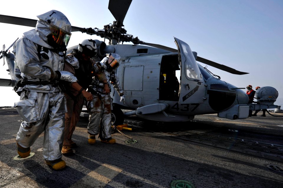 Flickr - Official U.S. Navy Imagery - Sailors train for evacuating a helicopter.