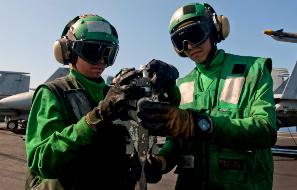 Flickr - Official U.S. Navy Imagery - Sailors perform a pre-flight check on a hold back bar.