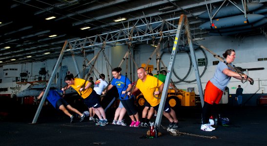 Flickr - Official U.S. Navy Imagery - Sailors participate in total resistance exercise in the hangar bay.