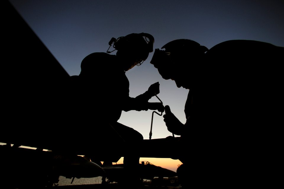 Flickr - Official U.S. Navy Imagery - Sailors perform maintenance on a jet.
