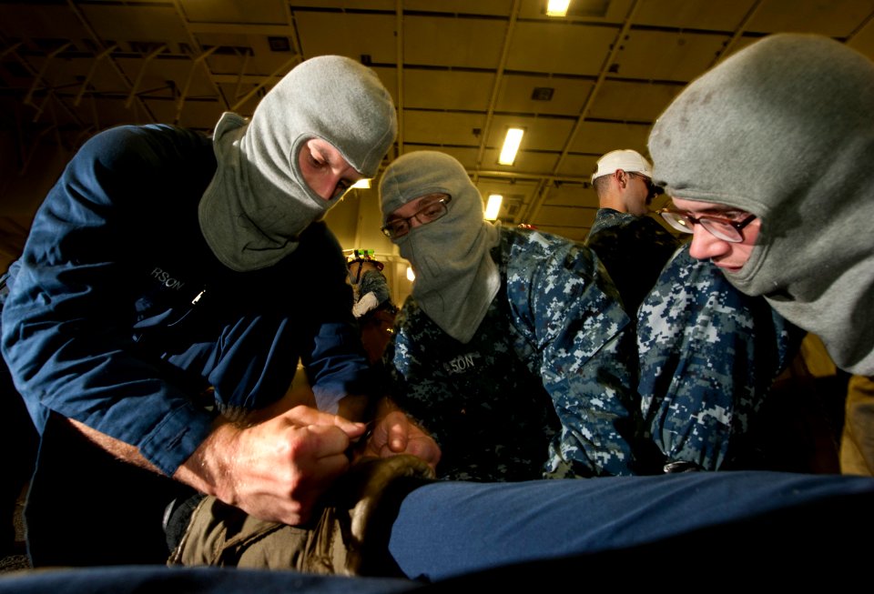 Flickr - Official U.S. Navy Imagery - Sailors treat a simulated casualty during a general quarters drill.