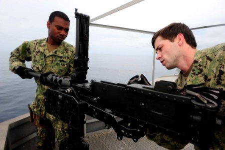 Flickr - Official U.S. Navy Imagery - Sailors perform maintenance on an M2HB .50-caliber heavy machine gun aboard High-Speed Vessel Swift (HSV) 2.
