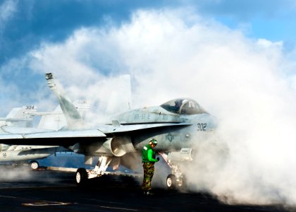 Flickr - Official U.S. Navy Imagery - Sailors prepare to launch a jet from USS John C. Stennis.