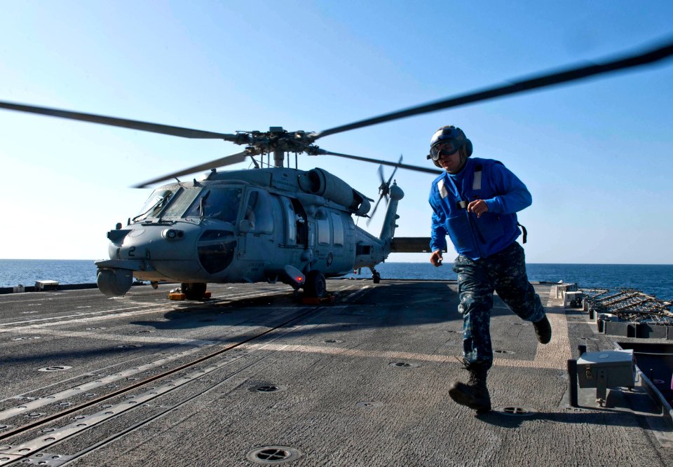 Flickr - Official U.S. Navy Imagery - Seaman Robert Estronza runs from the landing area on the Ticonderoga-class guided-missile cruiser USS Cape St. George.